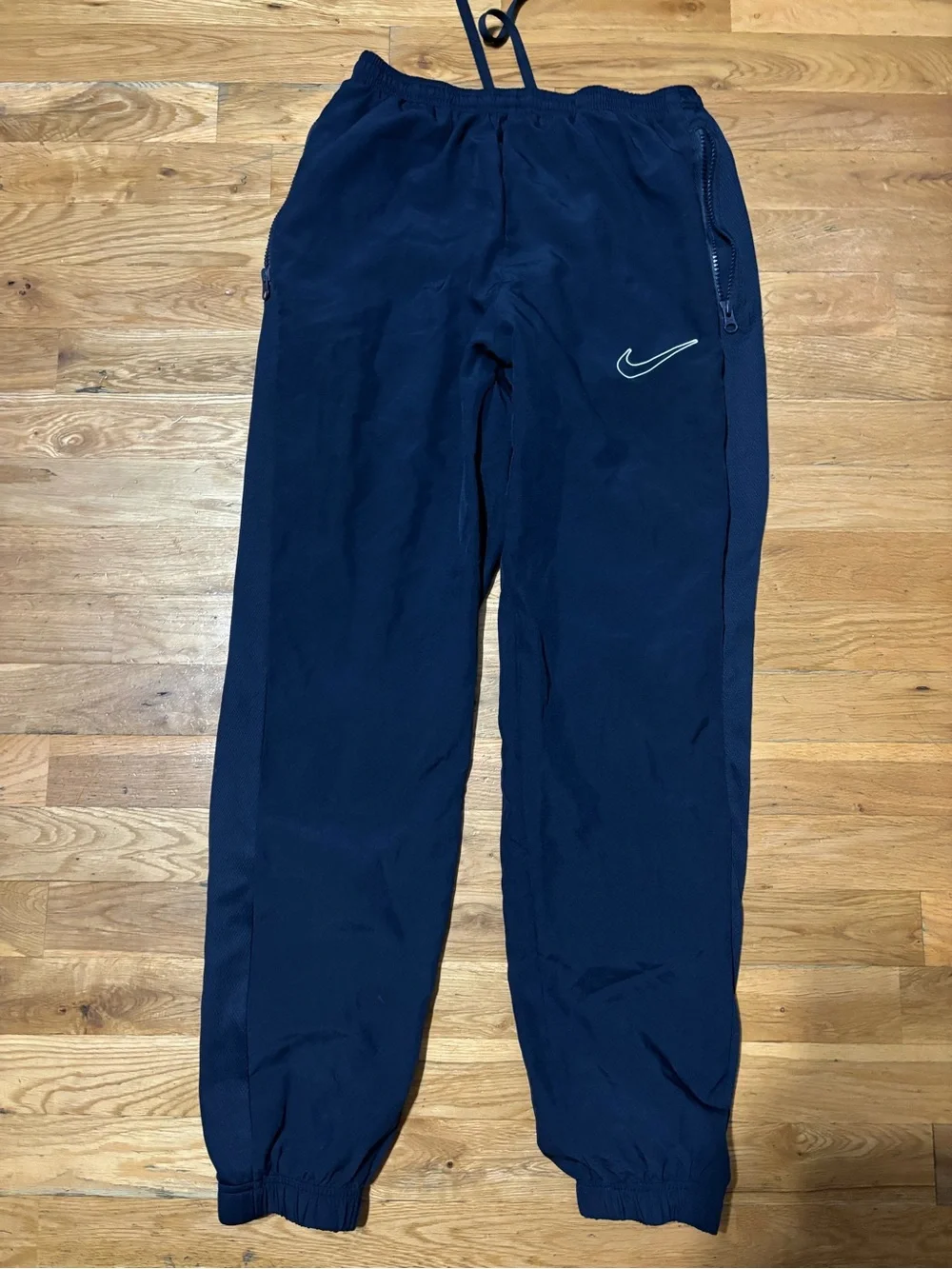 Nike White Tag with Black Swoosh and Text